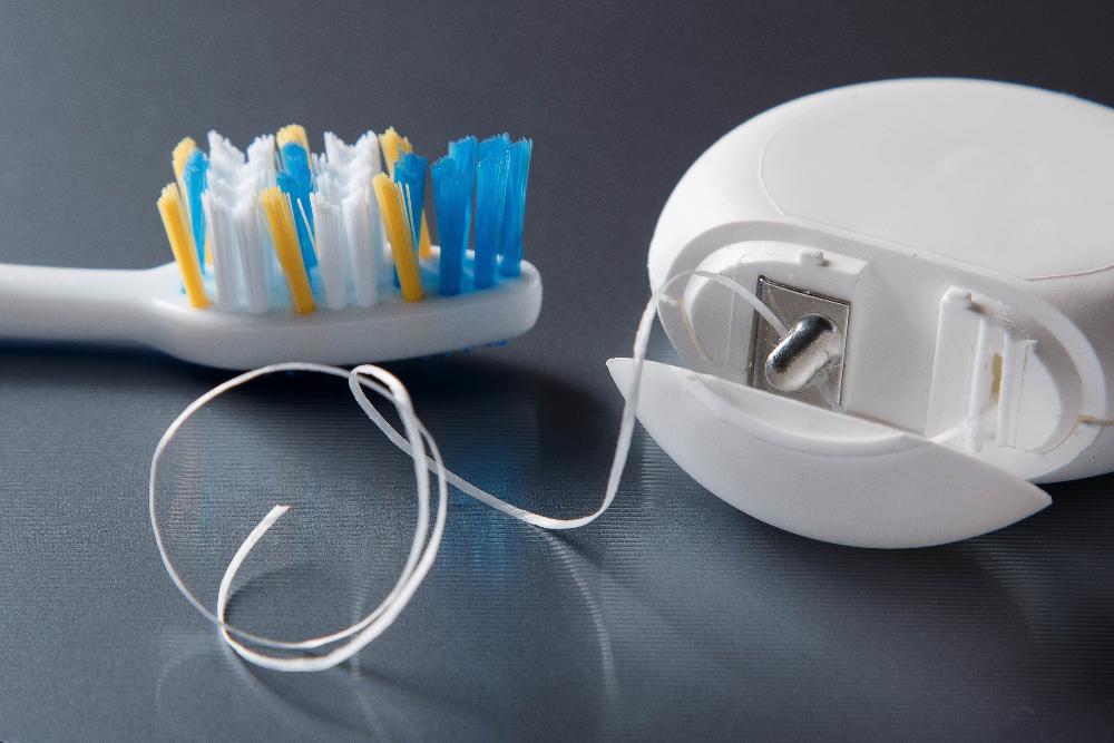 close up of dental floss | cosmetic dentist oakbrook terrace