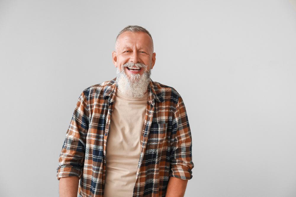 man with long beard smiling | airway dentist near me