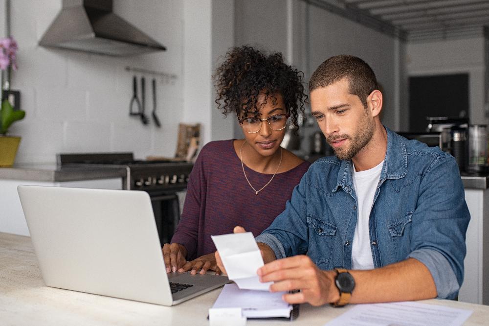 young couple looking at dental insurance forms | dentist oakbrook terrace il