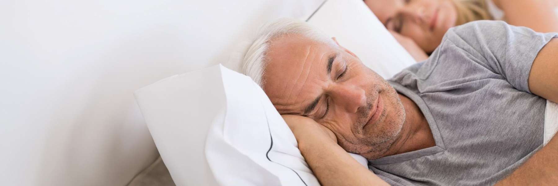 man sleeping peacefully in bed | airway orthodontics near me