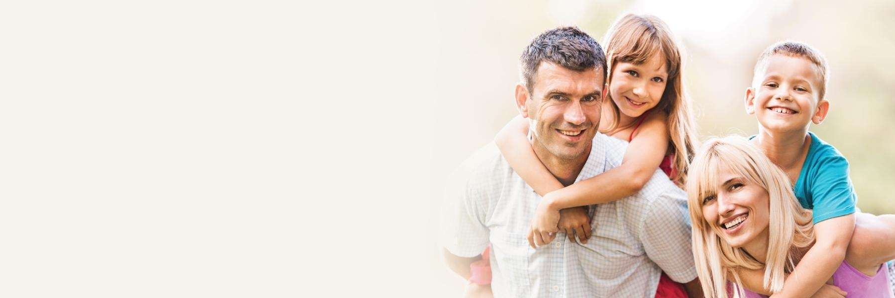 family of four smiling | dentist oakbrook