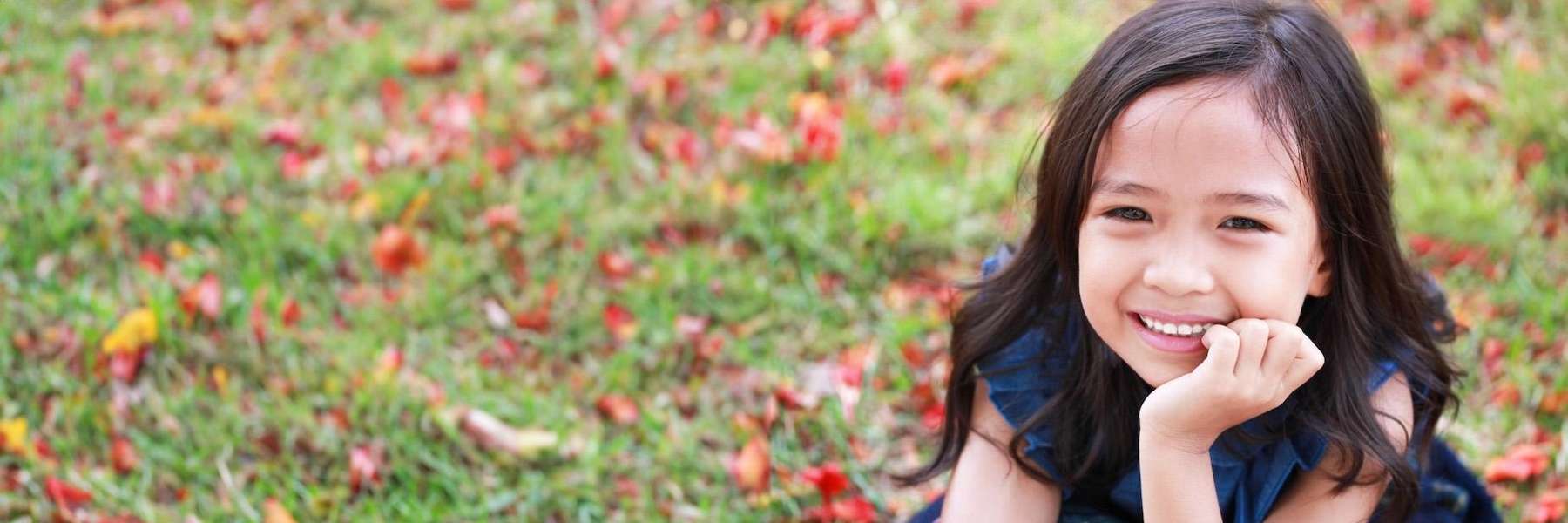 young girl smiling outside | dentist oakbrook terrace il