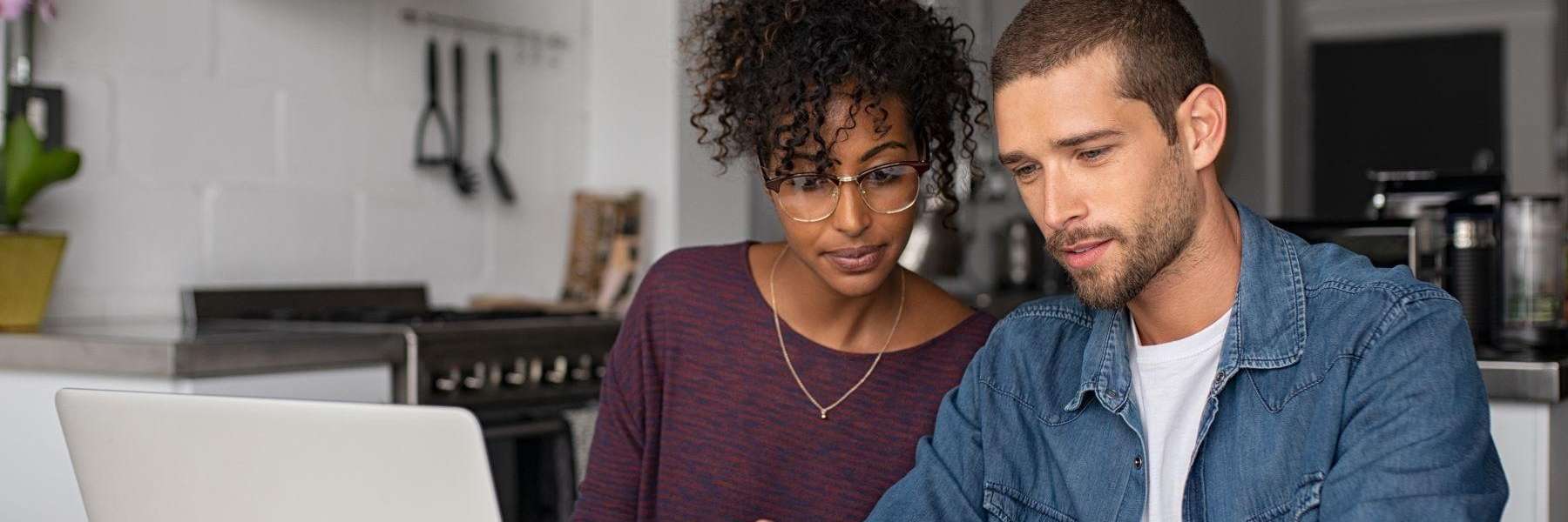 couple looking at computer | dental exams oakbrook terrace
