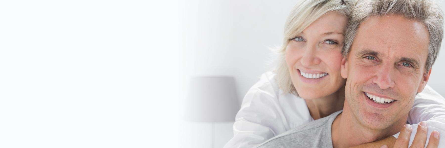 older couple hugging | dental exams oakbrook terrace